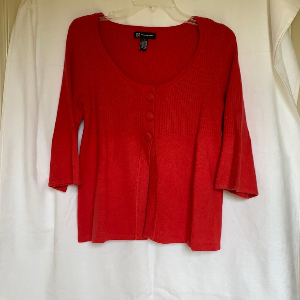 Red sweater top, size large. Mild to medium wear.